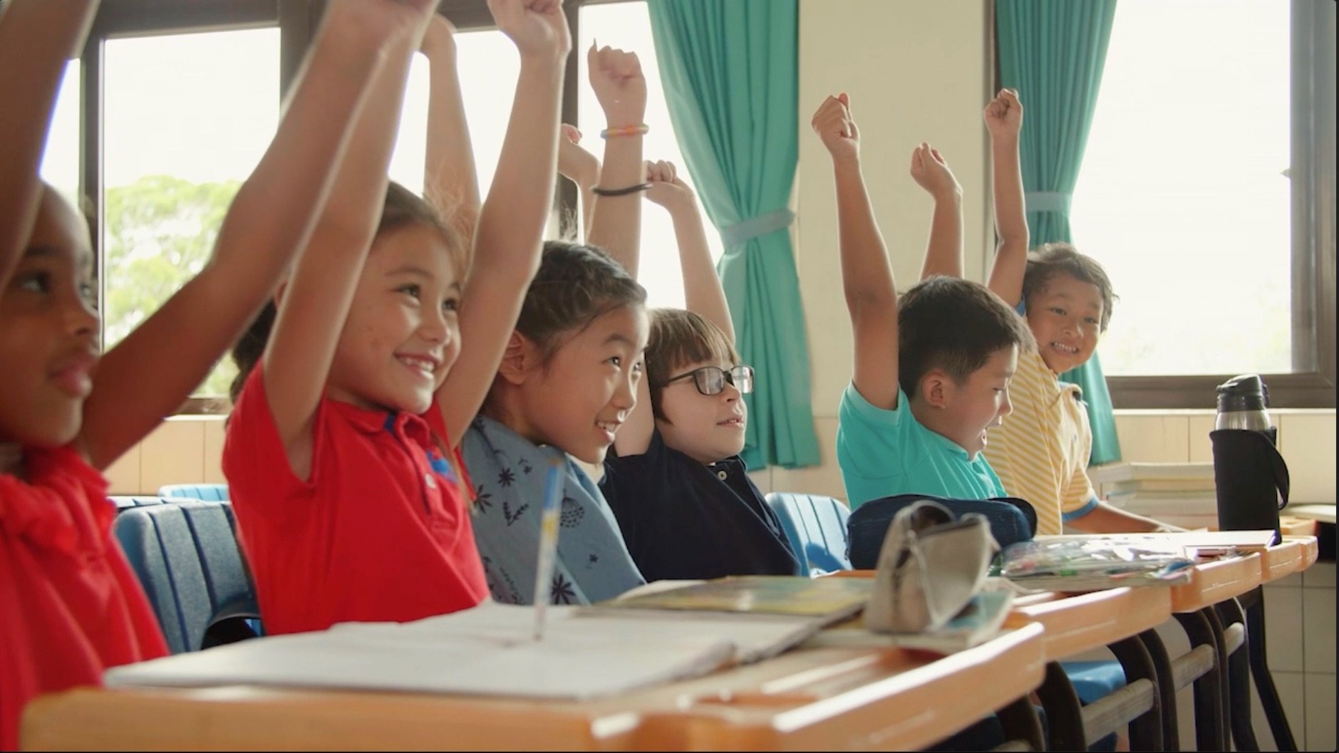Kids in school celebrating